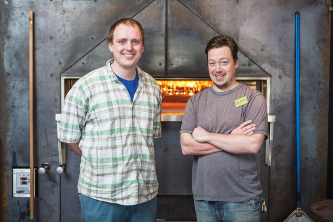 Seth and Buddy in front of Burlington oven.